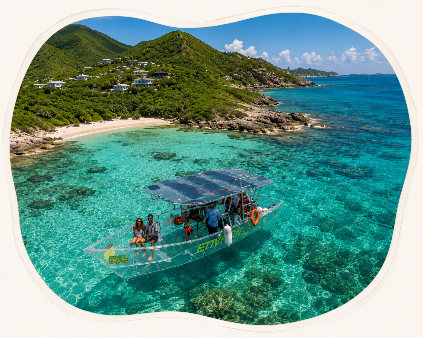 Nevara boat floating in clear turquoise water near a lush St. Maarten cove.